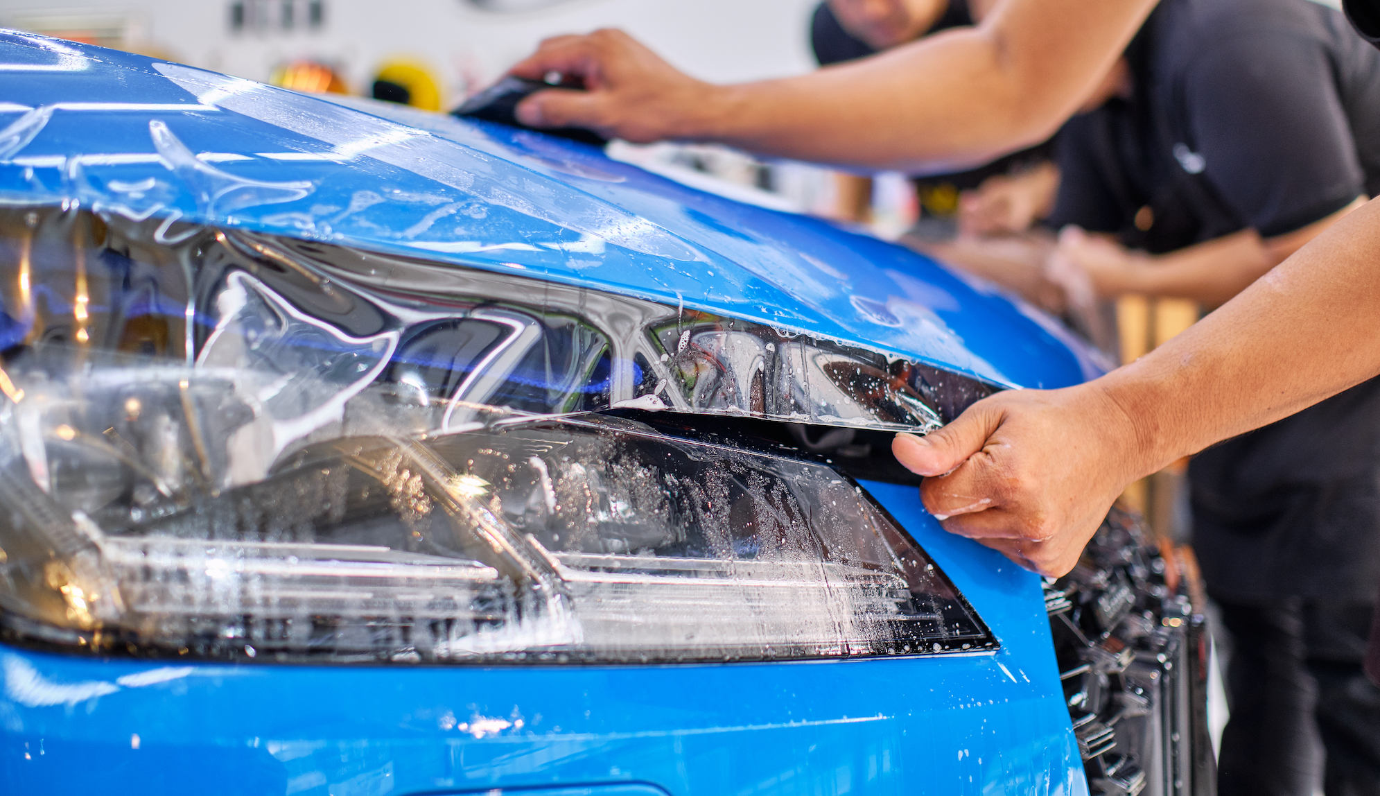 Paint,Protection,Film,Installation,On,Hood,Panel,Of,Luxury,Sports